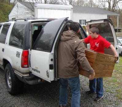 volunteers load car