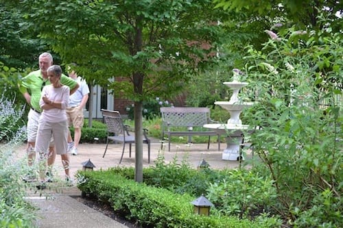 Guests visit the garden courtyard at The Center for Compassionate Care during the Mt. Lebanon Garden Tour.