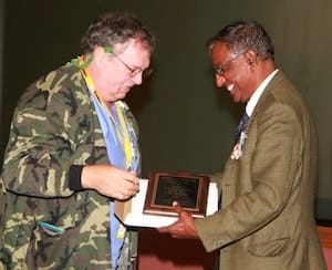 Steve  Stache (left) receives his award from Dr. Vasu Melepati. 