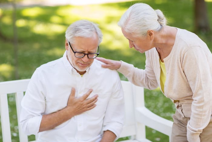 old age, health problem and people concept - senior man feeling sick at summer park