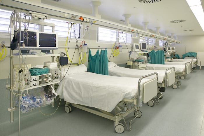 Hospital intensive care unit area with beds equipment. Health center