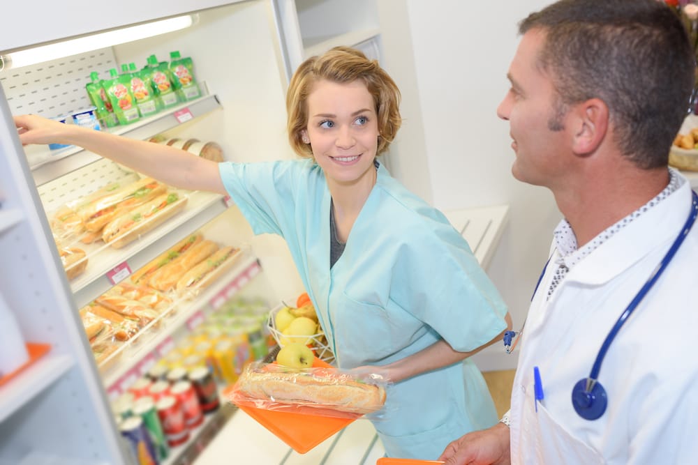 medical doctor with nurse during lunch break