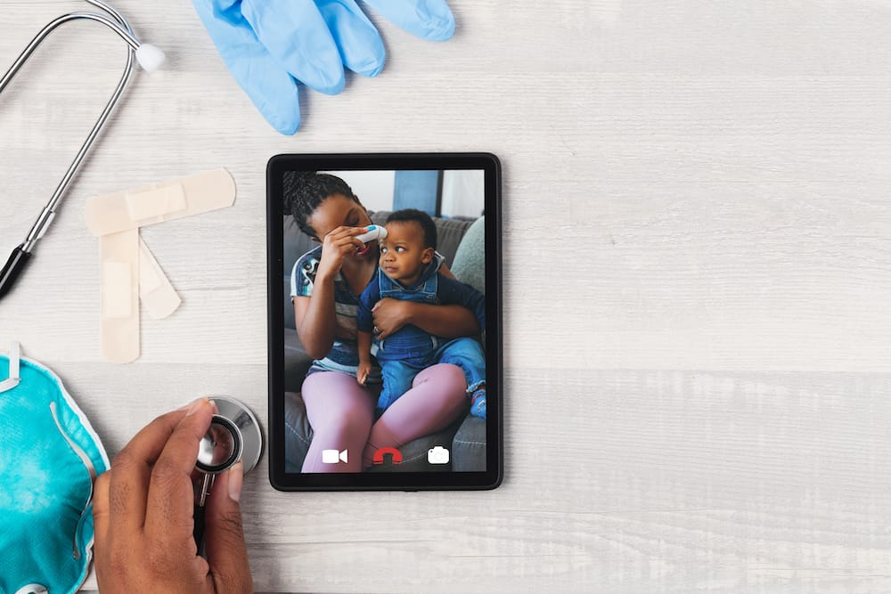 Doctor and patient having a telehealth video chat