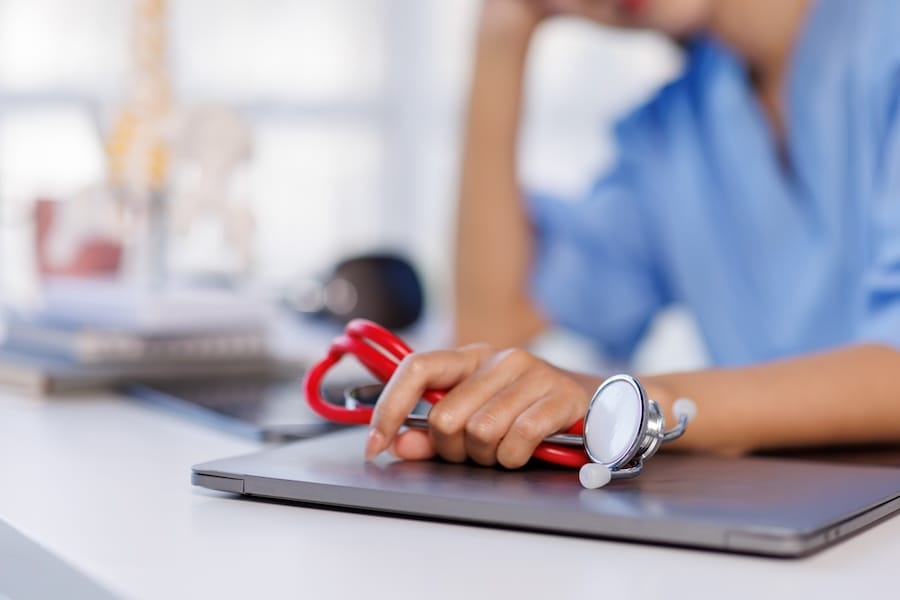 Headache stress, nurse or doctor asian woman in hospital feeling pain, tired or sick. Healthcare, wellness or female medical physician with depression or burnout while working late on laptop